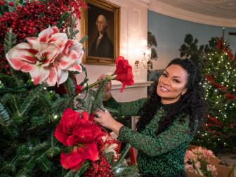 As seen on HGTV's White House Christmas 2016, host Egypt Sherrod, places a red flower in a Christmas tree in the Diplomatic Reception Room of the White House. The Diplomatic Reception Room serves as an entrance to the White House from South Grounds for the family and for ambassadors arriving to present their credentials to the President. This year’s holiday theme, “The Gift of the Holidays,” reflects on not only the joy of giving and receiving, but also the true gifts of life, such as service, friends and family, education, and good health, as we celebrate the holiday season.