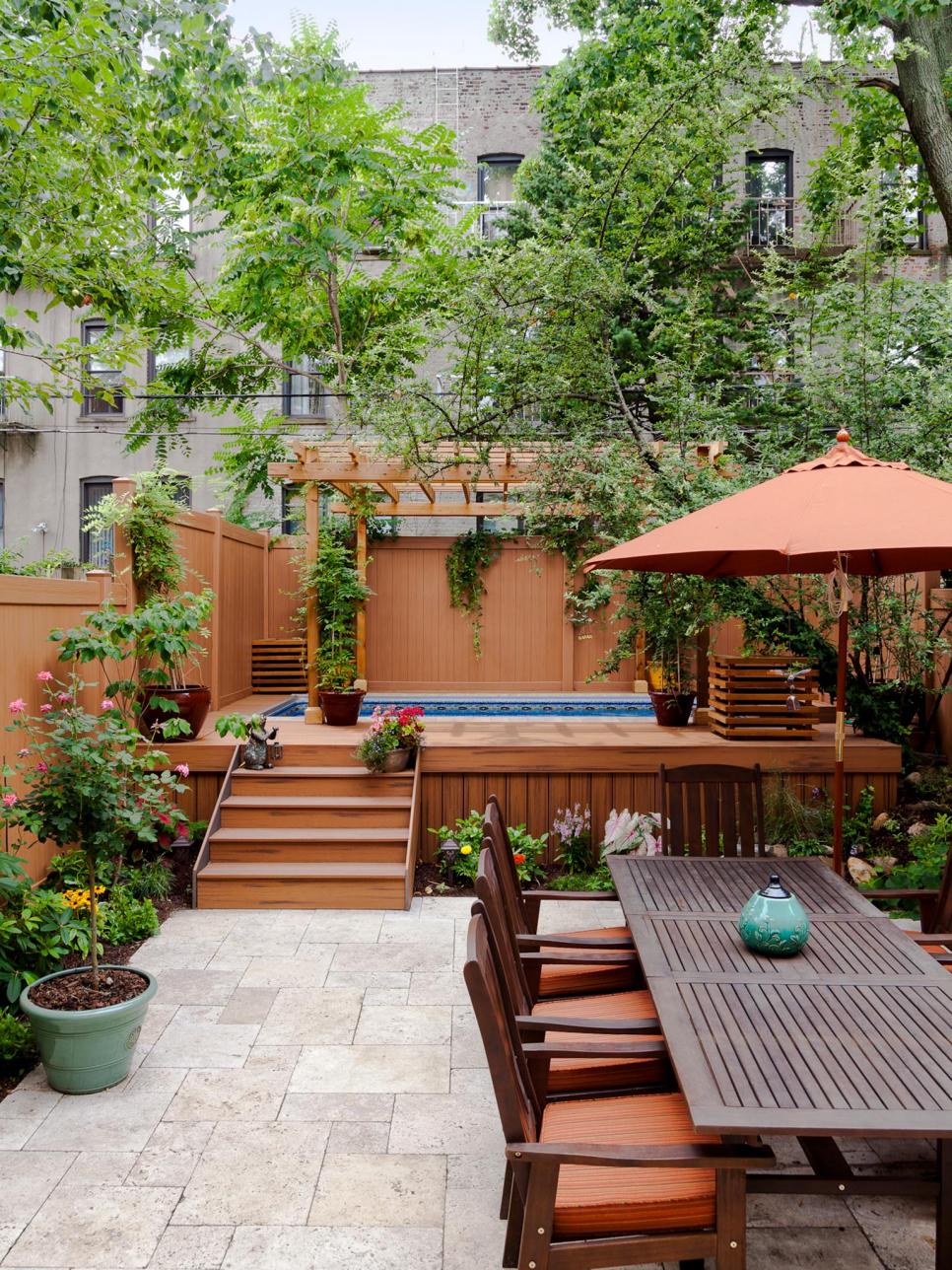 Urban Patio With Dining Area and Hot Tub Featuring Brick Red Fabrics