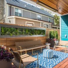 Small Deck With Custom Vertical Garden, Wood Privacy Wall and Bright Blue Accents 