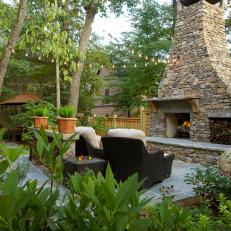 Wood-burning Fireplace Warms Outdoor Living Room While Concealing Wiring for a Flat Screen TV