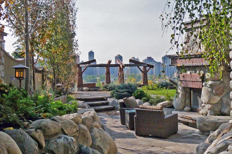 Outdoor Seating Area With Custom Outdoor Fireplace and City Skyline