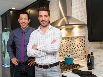Hosts Drew (L) and Jonathan Scott (R) pose for a portrait in the newly-remodeled master kitchen of Tom and Brdiget Suvansri's home in Stamford, Connecticut, as seen on Property Brothers. (portrait)
