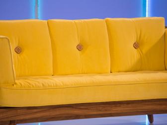 Designed for a green room of The Ellen DeGeneres Show, designers Kyle Huntoon sofa's, made of teak wood and a striking yellow upholstery, is presented on judging day, as seen on Ellen's Design Challenge. Ellen DeGeneres puts eight furniture designers to the test when they come to Los Angeles to compete in various challenges designing and building amazing furniture creations. With a workshop, a lead carpenter and all the tools they’ll need, the contestants will be tasked with a new build each episode. A panel of expert judges along with appearances by Ellen will eliminate them one by one until one designer is left standing to take home the cash prize and win “Ellen’s Design Challenge.”