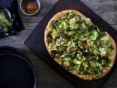 Brussels sprouts come to life atop this savory flatbread. By using only the petals, these green crisps bring surprising texture.