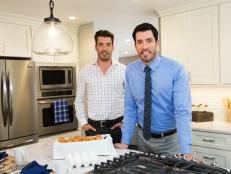Hosts Jonathan (L) and Drew (R) Scott pose for a portrait in the newly-renovated kitchen of Suzanne and Kevin Vining's Pound Ridge, New York, home, as seen on Property Brothers. (portrait)