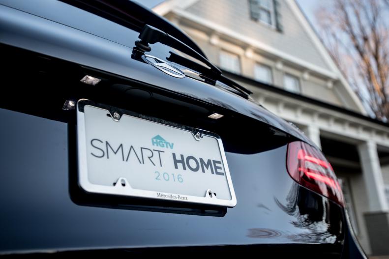 Smart Home 2016 License Plate on Black Midsize SUV