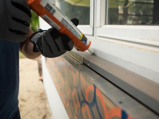 It’s important to run a bead of exterior caulk where the bar meets the house, as any moisture that seeps in could damage it or your home’s siding down the line. A high quality exterior grade silicon or caulk will keep it well sealed and protected for years to come.
