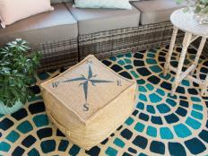 Easily give a plain-Jane outdoor ottoman a beachy upgrade with a nautically inspired stencil and exterior paint.