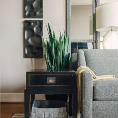 Black End Table and Gray Basket