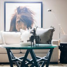 Sofa and Glass Table With Horse Art