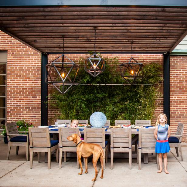 Steel Pergola with Dining Table and and Hanging Light Pendants 