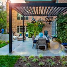 Contemporary Courtyard with Custom Pergola, Pendants and Dining Table 