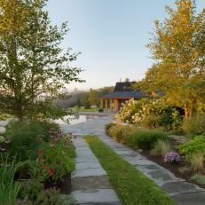 Rustic Outdoor Space with Stone Walkway through Native Plants, Perennials and Annuals