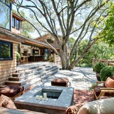 Seating Area on Deck With Fire Pit and Large Shade Tree