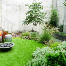 Modern Outdoor Space with Circular Garden and Cement Walls