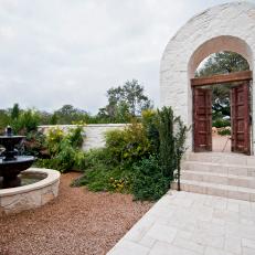 Landscaped Courtyard with Stone Garden Gate