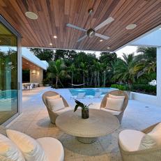White Wicker Seating Area with Pool View