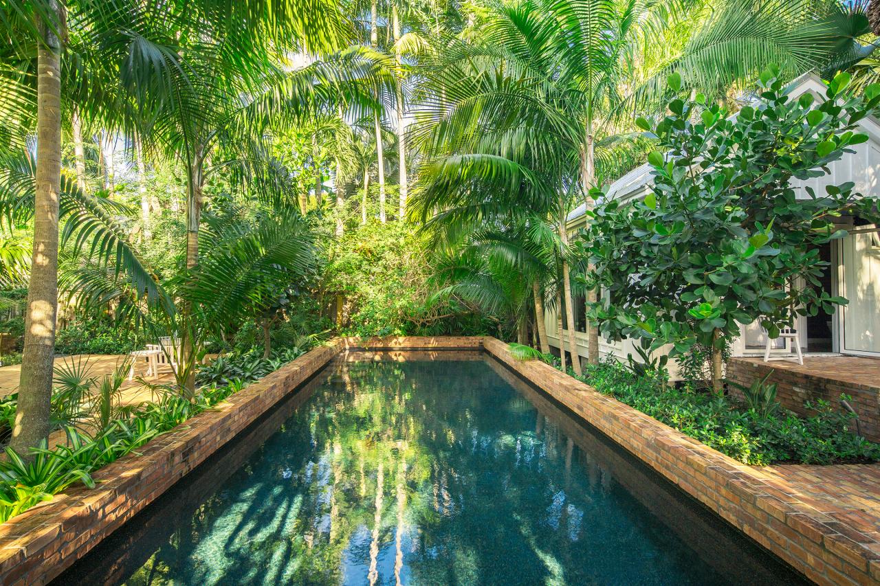 Landscape Your Pool For A Lush Look Diy, Palm Tree Landscaping Around Pool