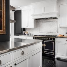 Black and White Country Kitchen With Black Stove