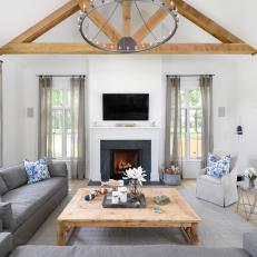 Gray Country Living Room With Exposed Beams