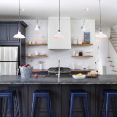 Gray and White Country Kitchen With Blue Barstools