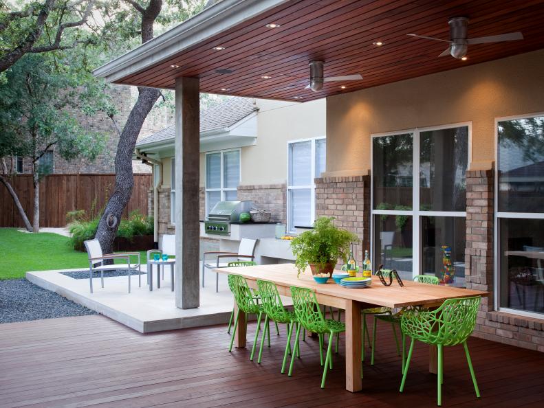 Outdoor Dining Area with Built-in Grill and Ceiling Fans