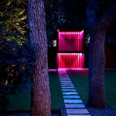 Walkway to Play Structure at Night with Red Light