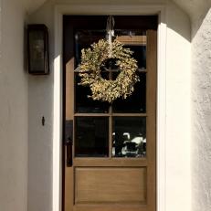 Traditional Brown Front Door with Boxwood Wreath 