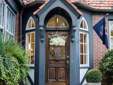 Tudor-style Front Entryway with Brick Steps