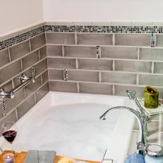 Bathtub With Gray Tile Backsplash