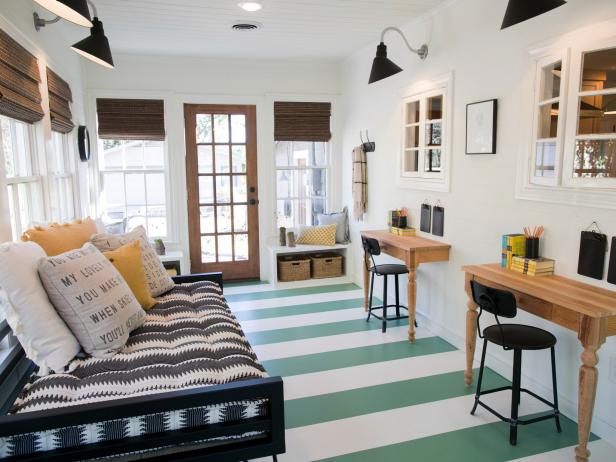 The sun room of the Eggers home has been completely transformed and features custom flooring design, new light fixtures, and built in desks, as seen on Fixer Upper. (after #9)