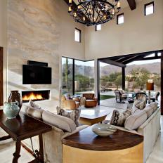 Open-Air Mediterranean Great Room With Exposed Beam Vaulted Ceiling