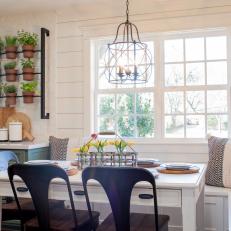 Country Breakfast Nook With Bench Seating, Natural Lighting and Simple Country Table Setting 