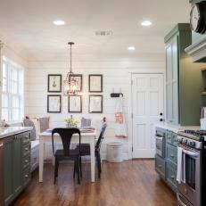 White Shiplap and Sage Green Cabinetry in Country Kitchen With Bench Seating Breakfast Nook
