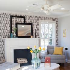 Sunny, Contemporary Living Room With Black and White Patterned Accent Wall and Tufted Furniture 