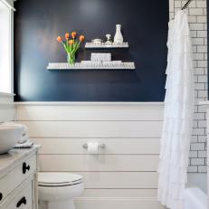 Navy Accent Wall Over White Shiplap in Country Bathroom With Subway Tile Shower and Ruffle Shower Curtain 