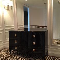 Contemporary Black Dresser and Zebra Print Rug in Transitional Hall Design With Mirror Panels