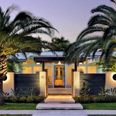 Contemporary Style Home with Large Palms and Landscape Lighting