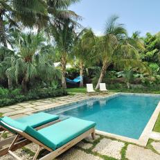Tropical Oasis Outdoor Pool and Lounge Area
