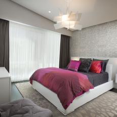 Modern Gray Guest Bedroom With Pink Duvet