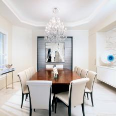 White Art Deco Dining Room With Chandelier 