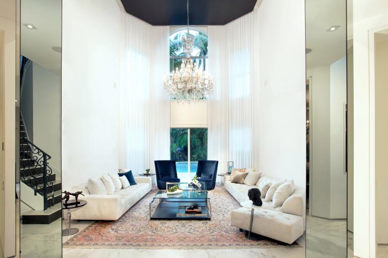 White Living Room With High Ceiling