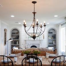 Contemporary Dining Room With Chandelier and Recessed Lighting