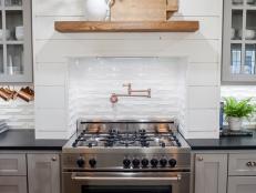 White Shiplap Walls and Gas Stove in Kitchen