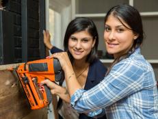 Hosts Lex and Alana LeBlanc team up to utilize the nail gun on the Perkins fireplace, as seen on Listed Sisters.