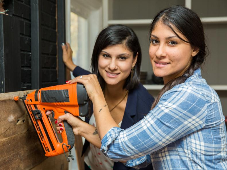 Hosts Lex and Alana LeBlanc team up to utilize the nail gun on the Perkins fireplace, as seen on Listed Sisters.
