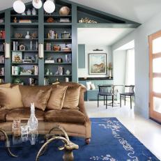 Eclectic Family Room With Bookshelf Wall
