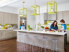 Vibrant Kitchen With Neon Pendant Lamps