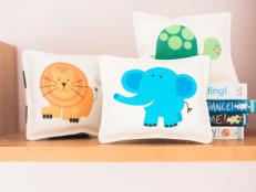 Give the new parents a set of one-of-a-kind baby rattles to celebrate their bundle of joy. Babies love contrasting colors, soft textures, and fun rattle sounds. These DIY sewn baby rattles have all three of those elements plus the addition of cute animal photos.