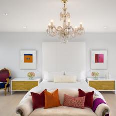 Fun, Eclectic Bedroom Design With Bold Pops of Color, Textured Modern Nightstands and Crystal Chandelier 